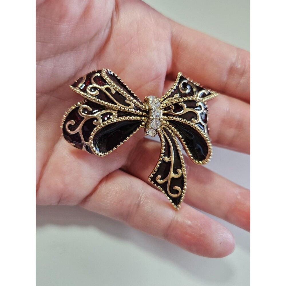Monet gold tone bow brooch black red clear rhinestone